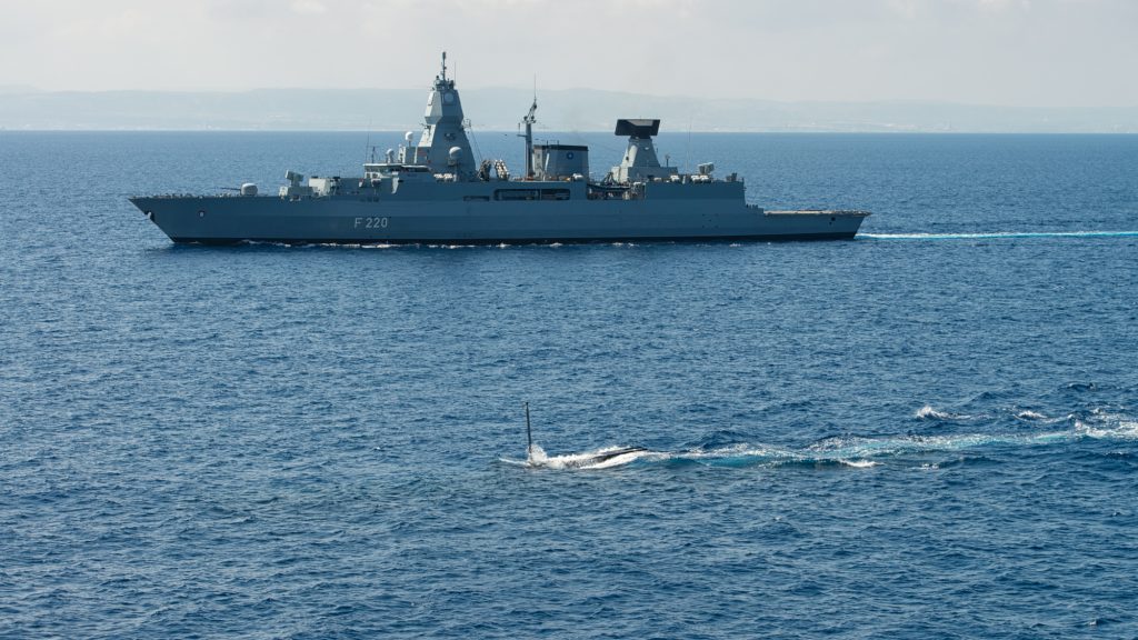 NATO warships and submarines patrol in the Mediterranean Sea.