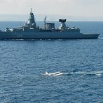 NATO warships and submarines patrol in the Mediterranean Sea.