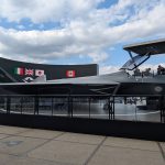 The full-size GCAP mock-up outside the Edgewing building at the 2026 Farnborough International Airshow, with the Canadian flag joining those of the UK, Italy and Japan on the electronic billboard behind it with Canada becoming an Observer Nation on the programme. (P Felstead)